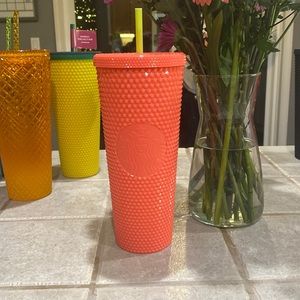 Hot pink  and lime Starbucks cup